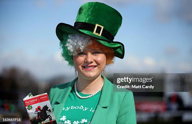 Racegoer Margaret Connolly dresses for St Patrick's Thursday at Cheltenham Racecourse on the third day of the Cheltenham Festival 2013 on March 14,...