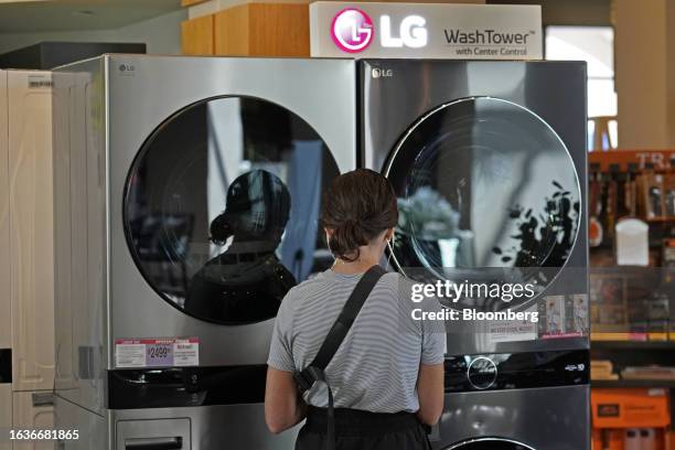 Customer looks at LG washing machines and dryers at a RC Willey home furnishings store in Draper, Utah, US, on Monday, Aug. 28, 2023. The US Census...