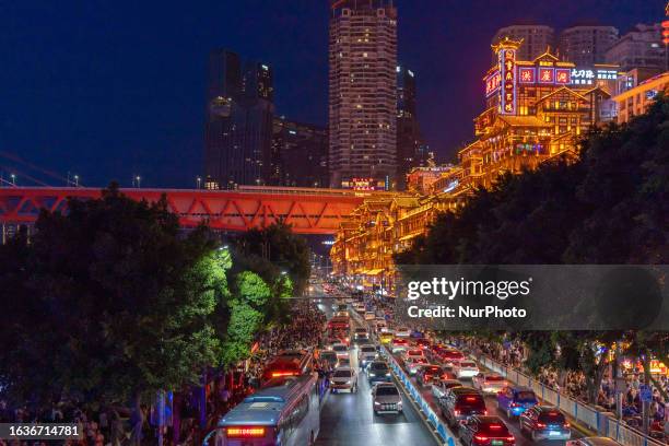 Tourists flock to Hongya Cave scenic spot in Chongqing, China, Aug. 15, 2023. According to the latest data from the China Tourism Academy, the number...