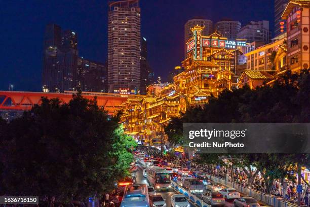 Tourists flock to Hongya Cave scenic spot in Chongqing, China, Aug. 15, 2023. According to the latest data from the China Tourism Academy, the number...