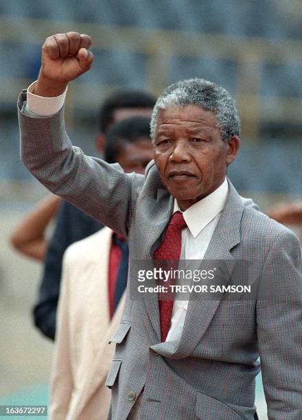 Picture taken on February 25, 1990 shows anti-apartheid leader and African National Congress member Nelson Mandela raising a clenched fist as he...