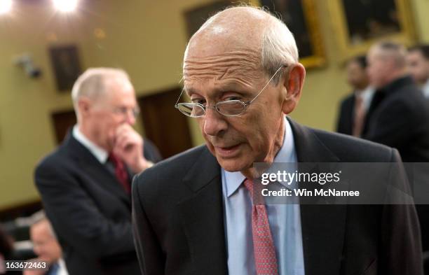 Supreme Court Associate Justices Anthony Kennedy and Stephen Breyer await the start of a hearing on Capitol Hill March 14, 2013 in Washington, DC....