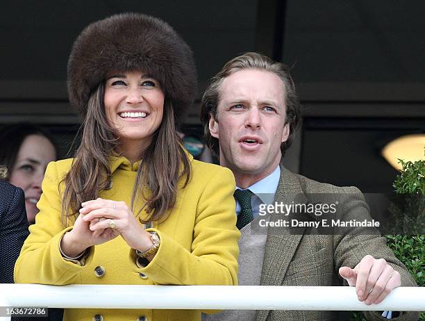 Pippa Middleton and friend Tom Kingston watch the Queens Mother Champion Steeple Chase on day 3 of the Cheltenham Festival at Cheltenham Racecourse...