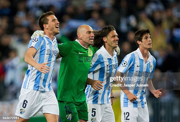 Ignacio Camacho, goalkeeper Willy Caballero, Martin Demichelis and Lucas Piazon of Malaga CF celebrate at the end of the UEFA Champions League Round...