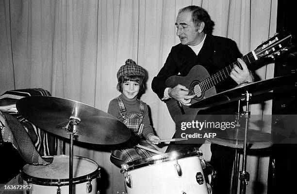 An archive photo taken on November 14, 1974 in Paris shows French clown and circus operator Achille Zavatta playing with his son Eric. Achille...