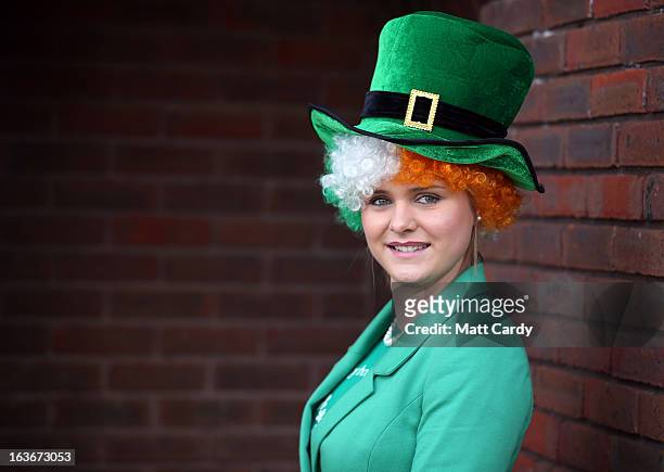 Racegoer Margaret Connolly poses wearing a costume for St Patrick's Thursday at Cheltenham Racecourse on the third day of the Cheltenham Festival...