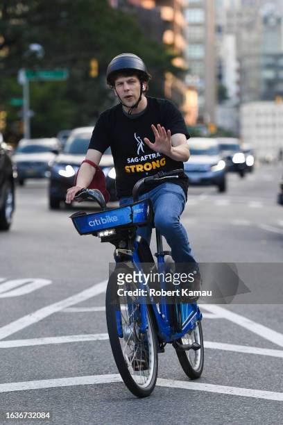 Jessie Eisenberg seen out biking in Manhattan on August 23, 2023 in New York City.
