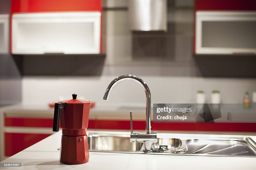 Modern kitchen counter top, faucet,coffe machine and washbasin