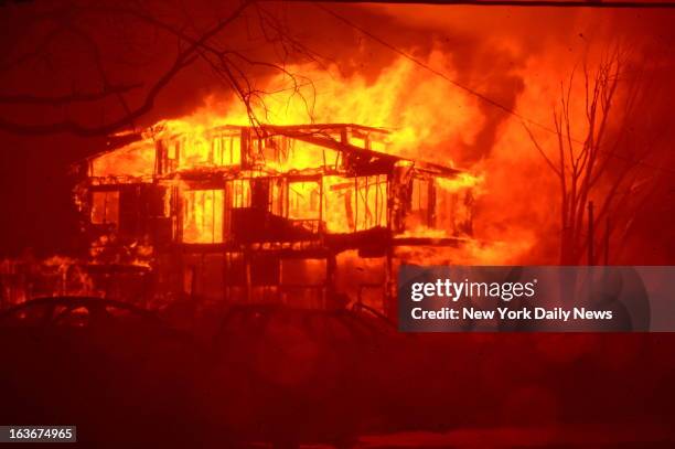 Massive fires destroyed 110 homes in Breezy Point, Brooklyn, one of the most devastating fires as a result of Hurricane Sandy. Pictures taken during...