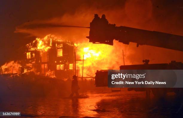 Massive fires destroyed 110 homes in Breezy Point, Brooklyn, one of the most devastating fires as a result of Hurricane Sandy. Pictures taken during...