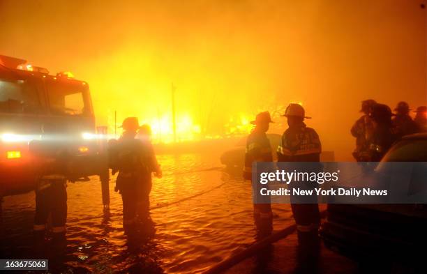 Massive fires destroyed 110 homes in Breezy Point, Brooklyn, one of the most devastating fires as a result of Hurricane Sandy. Pictures taken during...