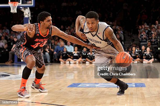 Vauntes Smith-Rivera of the Georgetown Hoyas drives in the first half against JaQuon Parker of the Cincinnati Bearcats during the quaterfinals of the...