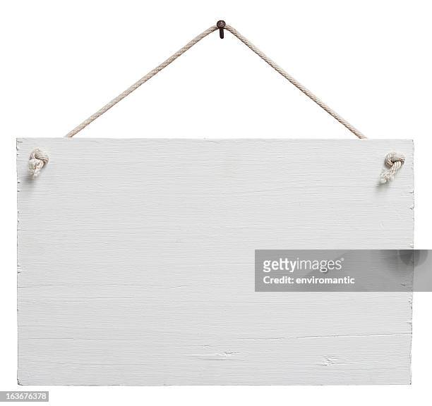 old weathered white wood signboard. - placard stockfoto's en -beelden