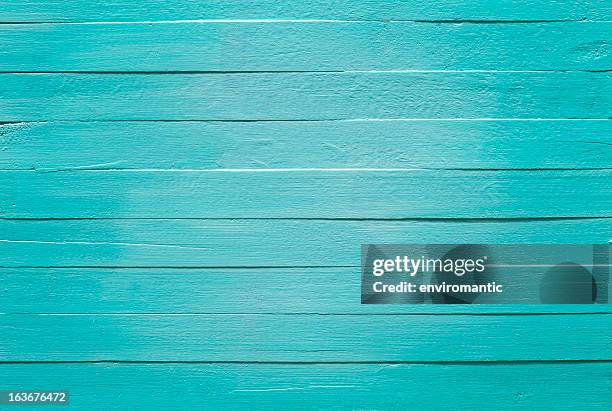 old turquoise wooden panel background. - dichtgetimmerd stockfoto's en -beelden