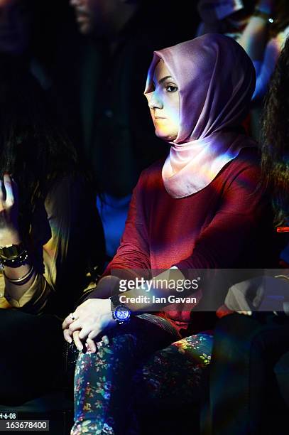 Guests attend the Mercedes-Benz Presents Ozlem Kaya show during Mercedes-Benz Fashion Week Istanbul Fall/Winter 2013/14 at Antrepo 3 on March 14,...