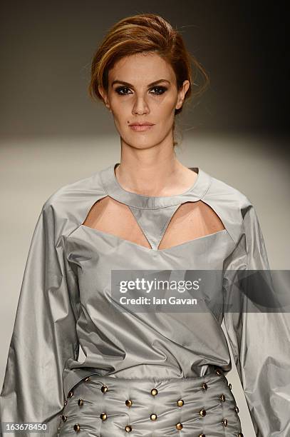 Model walks the runway at the Mercedes-Benz Presents Ozlem Kaya show during Mercedes-Benz Fashion Week Istanbul Fall/Winter 2013/14 at Antrepo 3 on...