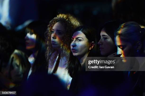 Guests attend the Mercedes-Benz Presents Ozlem Kaya show during Mercedes-Benz Fashion Week Istanbul Fall/Winter 2013/14 at Antrepo 3 on March 14,...