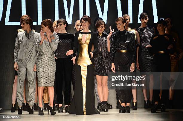 Model walks the runway at the Mercedes-Benz Presents Ozlem Kaya show during Mercedes-Benz Fashion Week Istanbul Fall/Winter 2013/14 at Antrepo 3 on...