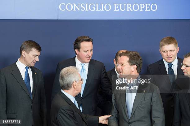 Estonian Prime Minister Andrus Ansip, British Prime Minister David Cameron, Italian Prime Minister Mario Monti, Dutch Prime Minister Mark Rutte chat...