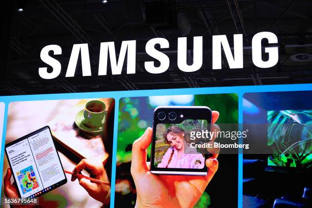 Galaxy Z Fold 5, left, and Z Flip 5 a smartphone on a screen ahead of a news conference in the Samsung Electronics Co. Hall at the IFA Consumer...
