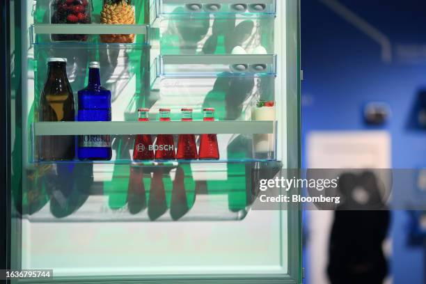 Food and drinks products on the interior shelf of a refrigerator at the Robert Bosch GmbH booth at the IFA Consumer Electronics and Home Appliances...