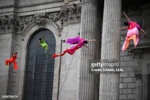 Dancers from the US company "Bandaloop" perform on the exterior walls of St Paul's Cathedral in London on August 31 to welcome the return of The City...