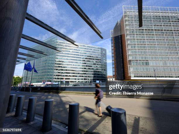 The flags of the European Union flutter in the winds in front of the Charlemagne and the Berlaymont, the EU Commission headquarter on August 31, 2023...