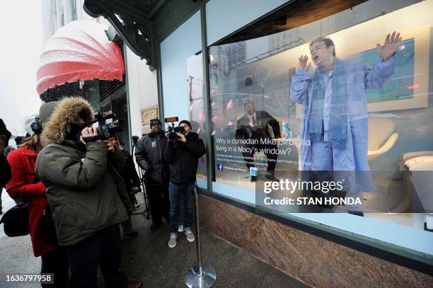 Comedian Mike Birbiglia jokes with the media as he begins a week of living in a Macy's window display during "Clean Sheet Week", a promotion for...