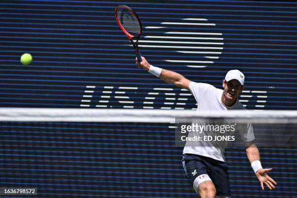 Britain's Andy Murray hits a return to Bulgaria's Grigor Dimitrov during the US Open tennis tournament men's singles second round match at the USTA...