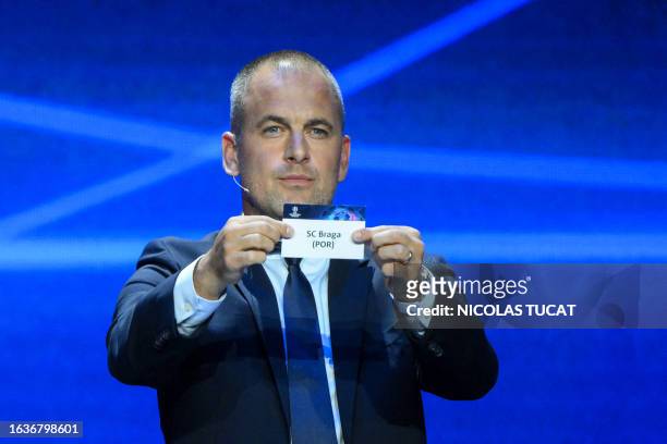 English former football player Joe Cole shows the paper slip of SC Braga during the draw for the 2023/2024 UEFA Champions League football tournament...
