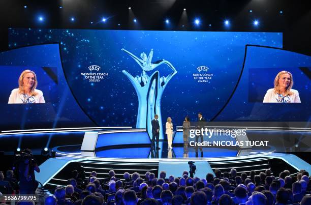 Dutch manager of the England women's national team Sarina Wiegman receives from UEFA president Aleksander Ceferin , British journalist Reshmin...