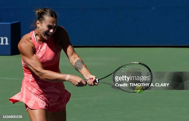 Belarus's Aryna Sabalenka hits a return to Britain's Jodie Burrage during the US Open tennis tournament women's singles second round match at the...