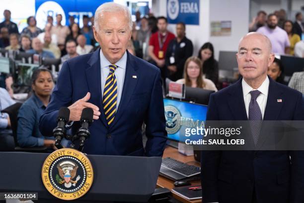 Homeland Security Secretary Alejandro Mayorkas looks on as US President Joe Biden speaks at the headquarters of the Federal Emergency Management...