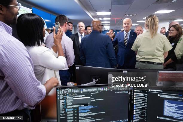 President Joe Biden visits the headquarters of the Federal Emergency Management Agency in Washington, DC, on August 31 to thank the team staffing the...