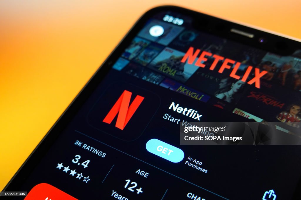 In this photo illustration, the Netflix logo is displayed in...