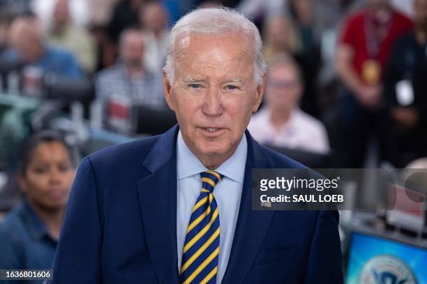 President Joe Biden speaks the headquarters of the Federal Emergency Management Agency in Washington, DC, on August 31 thanking the team staffing the...
