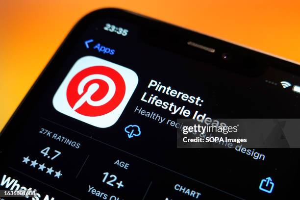 In this photo illustration, the Pinterest logo is displayed in the Apple App Store on an iPhone.