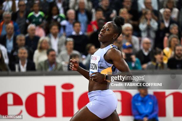 Jamaica's Shericka Jackson celebrates as she crosses the finish line in the women's 200m final during the Diamond League athletics meeting at Stadion...