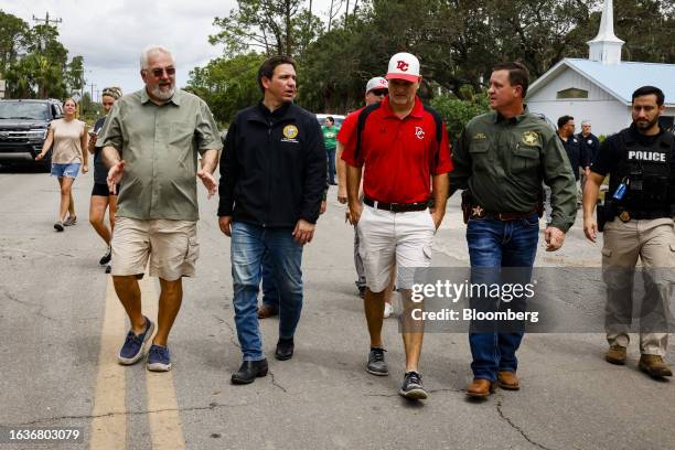 Ron DeSantis, governor of Florida and 2024 Republican presidential candidate, center left, during a visit after Hurricane Idalia in Horseshoe Beach,...