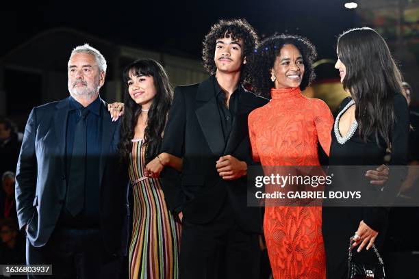 French director and producer Luc Besson poses with his wife Virginie Besson-Silla and his children Thalia Besson, Mao Besson, Sateen Besson on the...