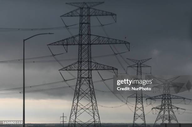 Network of electric polles with wires seen in Edmonton South area on August 23 in Edmonton, Alberta, Canada.