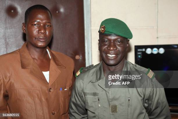 Captain Amadou Haya Sanogo , who emerged from obscurity to lead a coup in March 2012, poses with answers the director of the "Le Republicain" Malian...