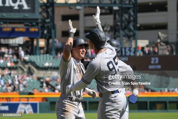 New York Yankees shortstop Anthony Volpe celebrates hitting a three-run game-tying home run with teammate New York Yankees third baseman Oswaldo...