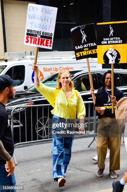 Tommy Dorfman walks a picket line in support of the SAG-AFTRA and WGA strike outside Warner Bros. Discovery Headquarters on August 24, 2023 in New...