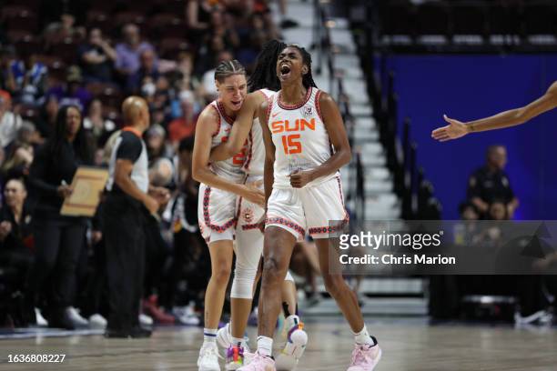 Natisha Hiedeman, Tyasha Harris, and Tiffany Hayes of the Connecticut Sun celebrate during the game against the Phoenix Mercury on August 31, 2023 at...