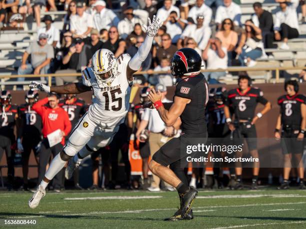 Western Michigan Broncos linebacker Donald Willis pressures St. Francis Red Flash quarterback Cole Doyle during the college football game between the...