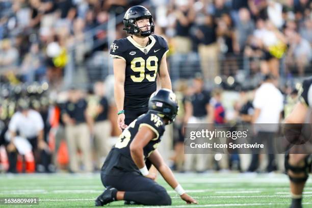 Matthew Dennis of the Wake Forest Demon Deacons lines up a field goal during a football game against the Elon Phoenix at Allegacy Federal Credit...