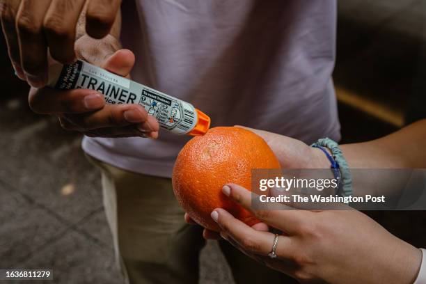 August 25, 2023 Students at Northwestern University in Chicago, Illinois, practice using an Epinephrine injection pen on oranges to know how to use...