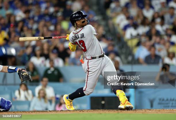 Ronald Acuna Jr. #13 of the Atlanta Braves hits a grand slam home run against starting pitcher Lance Lynn of the Los Angeles Dodgers during the...