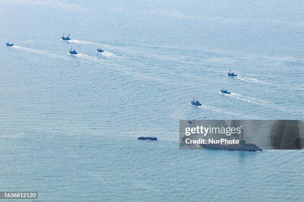 Fishing boats head to the Yellow Sea for the start of autumn fishing production in Qingdao, Shandong Province, China, Sept 1, 2023. On the same day,...